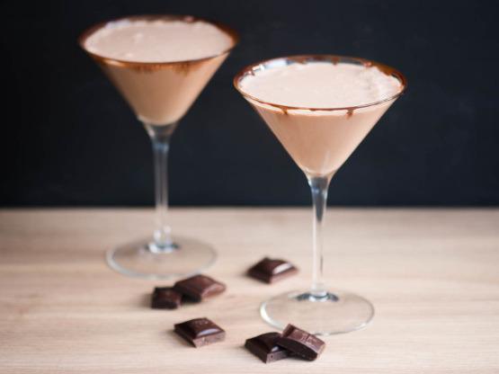 CHOCOLATE MARTINI MOCKTAIL 1/5 cup chocolate syrup or melted chocolate 1/4 cup coconut cream 1/8 cup Sprite Ice cubes Small chocolates Rim martini glass with chocolate syrup and