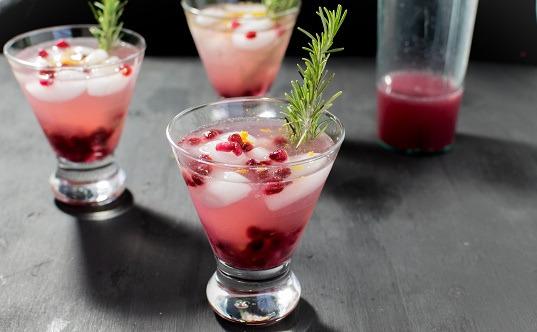 SPARKLING POMEGRANATE MOCKTAIL 4 cups 100% pomegranate juice 2 cups sugar 2 cans sparkling water Cranberries and rosemary as garnish In a saucepan, bring pomegraante juice to a boil - reduce heat and