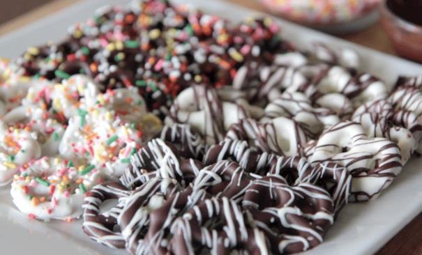 Quick and Easy Gluten Free Dipped Pretzels By Brenda Liddle Yield: About 30 cookies Ingredients White chocolate almond bark (GF) Milk chocolate almond bark (GF) Mini GF Pretzels Colored Sprinkles