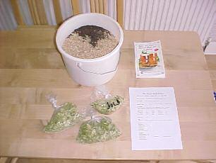 !! Raw ingredients for a brewing session, malted barley (dark and pale malt seen