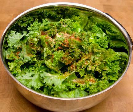 Veggies 101: All About Kale Step 5: Drizzle the oil over the kale and then sprinkle the spices on top.