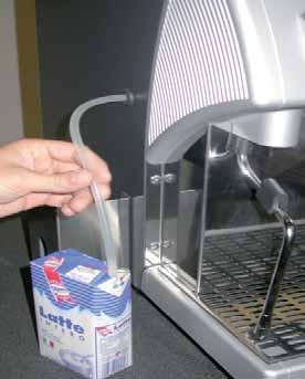 ) Insert the milk infeed tube into a container with
