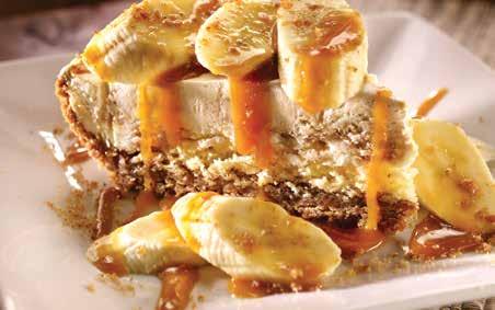 Bananas Foster Pie Chilled banana pudding and vanilla sponge cake layered in a cinnamongraham pastry with rum sauce and warm caramel.