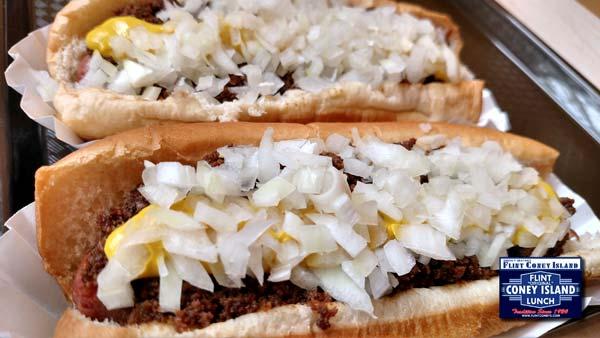 2. Chop a white onion, or a sweet onion if you d like, the finer the chop, the better. 3. Steam the buns, or microwave in pairs for 20 seconds. 4. Place the Coney Frank in the bun. 5.