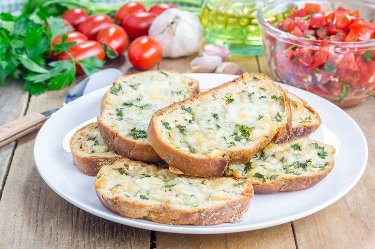 GARLIC TOAST WITH CHEESE French bread or Italian bread cut into slices For The Garlic Butter 4 tbsp. softened butter 6-7 flakes crushed garlic Pinch of salt ¼ tsp.