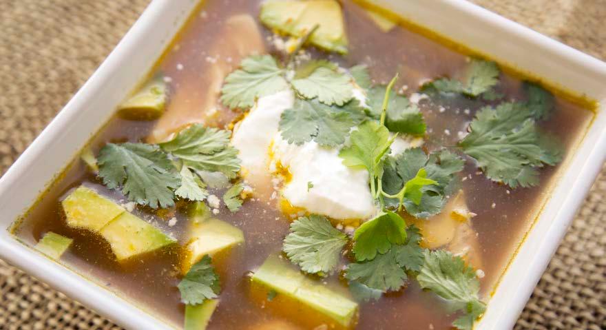 Not-Quite Tortilla Soup ¼ red onion, minced 1 clove garlic, crushed ¼ teaspoon cumin ¼ teaspoon sea salt ¼ cup cooked shredded chicken (optional) 1 tablespoon mild salsa ¼ avocado, diced 1 tablespoon