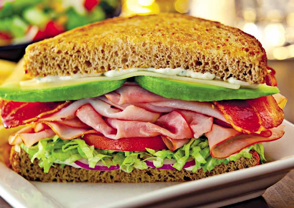 Classic Turkey Toasted Sandwich With lettuce, tomatoes, provolone and mayo on wheat Texas toast.