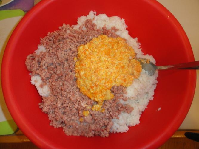Stuffing Preparation In a big bowl combine the rice, ground meat, and ½ of the