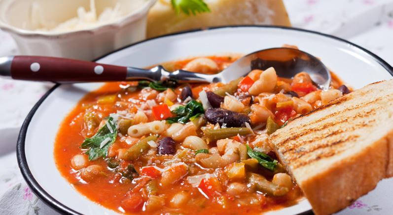 Harvest Minestrone 1 tablespoon olive oil 1 cup each chopped onion and carrot 4 cups reduced-sodium chicken broth 1 (28-oz.) can Italian-style crushed tomatoes 1 (15-oz.