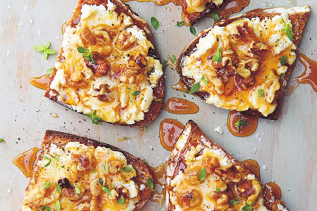 Goat Cheese Toasts whole-grain bread, 4 slices, each about 2 1/2 by 5 inches (6 by 13 cm), lightly toasted fresh goat cheese, 3 oz (90 g), at room temperature walnuts, 1/4 cup (1 oz/30 g) coarsely