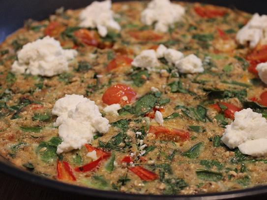 Spinach & cheese pizza small amount of coconut oil to grease dish 4 eggs 3 egg whites 4 cherry tomatoes, halved 40g baby leaf spinach, finely chopped 1 red chilli pepper, finely chopped (optional) ½
