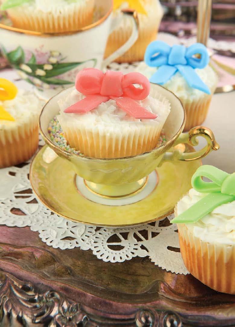 Fine China Teacups turn oh-so-cute when filled with bow-bedecked cupcakes. What a great way to incorporate mismatched china into your tablescape! Standard cupcakes work best here.