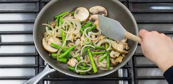 Add the asparagus, mushrooms, and onions and sauté for about 5 minutes until vegetables have softened.