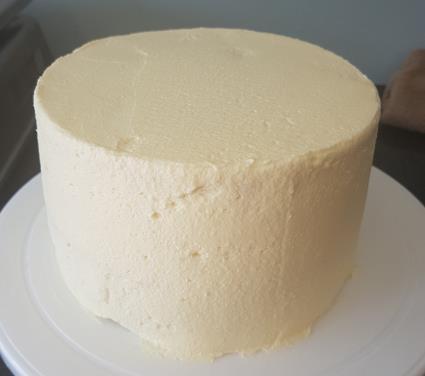 Apply a ring of white chocolate parles mixed with Lemon Fizzy balls to the base of the cake. Bake at 190ºC for 18-22 minutes. Remove from the tins and cool on a wire rack.