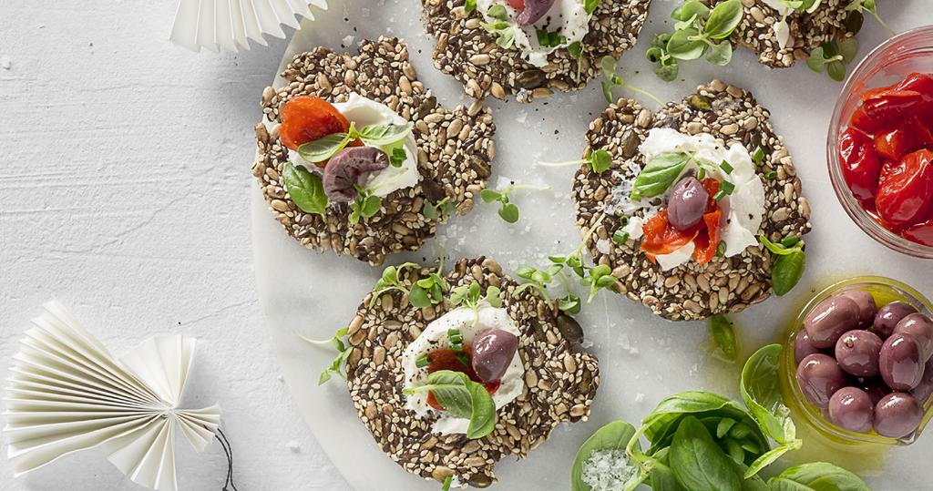 Seed cracker canapés WITH PEPPADEWS & OLIVES INGREDIENTS 16 HealthyFood Studio homemade seed and nut crackers, or Woolworths CarbClever seeded crackers 4 tbsp fat-free smooth cottage cheese Place