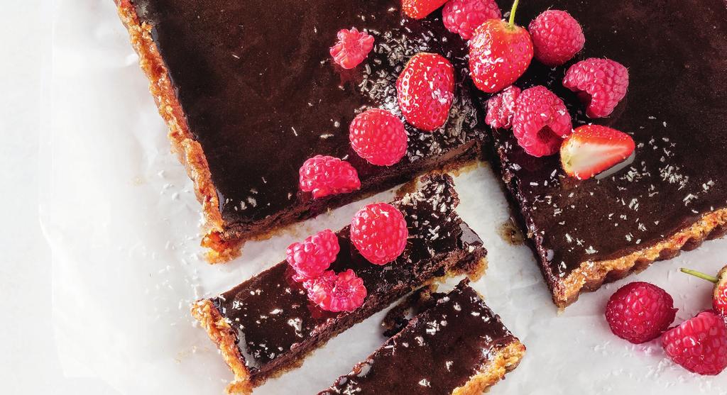 Date & coconut crusted DARK CHOCOLATE TART INGREDIENTS 1 cup dates ½ cup coconut 400g 80% dark chocolate 550ml low fat milk 3 eggs 200g mixed seasonal berries Spray & Cook Place the dates in a food