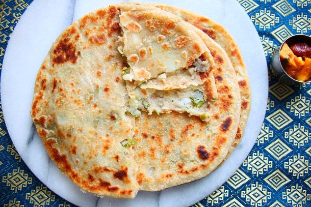 Aloo Paratha I fell in love with paratha at the age of four, when I was the proud owner of various miniature kitchen utensils that looked like they d been manufactured in toy town.