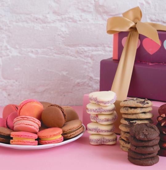 00 SWEET LOVE COMBO STACK Our premium Box of Heart-Shaped alfajores (5pc) Box of Mini Cookies Chocolate Chip, Triple Chocolate & Red Velvet Mini Cookies packaged with I