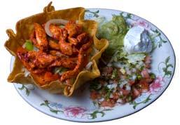 25 10. 1 Enchilada & Tostada... $11.25 Fajita Salad Served over a bed of shredded lettuce in a Crispy Shell served with sour cream guacamole bell peppers & onions pico de gallo.
