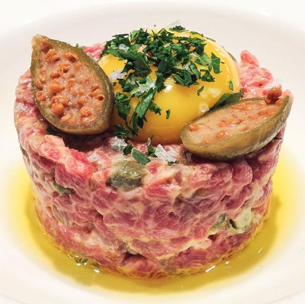 BEEF CRUDO Ingredients: 28 servings 5.5 pounds of Beef small dice 28 each Egg yolks 6 each Shallots minced 4 each Garlic cloves minced 4 TBL Dijon Mustard 3.