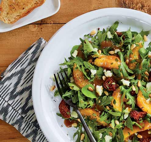 GLUTEN FREE SWEET FIG & MANCHEGO SALAD Peppery arugula is topped with sweet figs, manchego crumbles, orange segments and toasted pine nuts for a light Mediterranean salad.