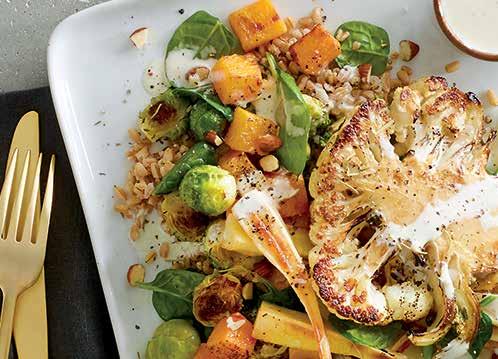 FARRO AND ROASTED VEGETABLE BOWL A hearty salad that would serve as a meal combines farro, roasted Brussels sprouts and parsnip with a grilled cauliflower steak and toasted almonds.