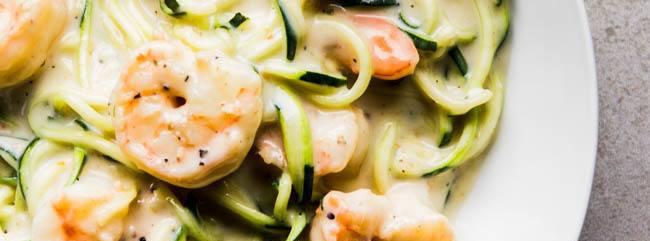 Prawn Alfredo on Zoodles 12 ingredients 15 minutes 4 servings 1. Heat the olive oil in a pan over medium-low heat. Add the onions and sauté for 4-5 minutes.