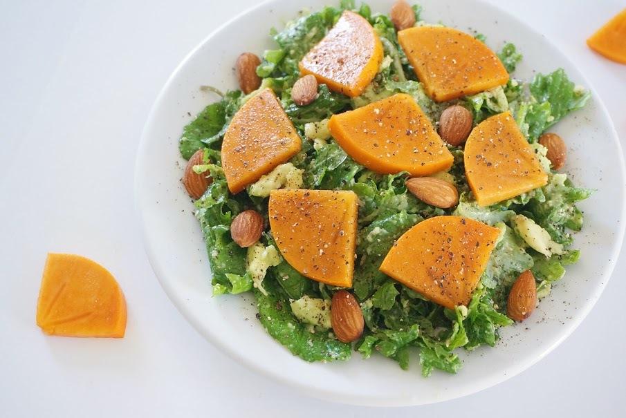 Rubbed Kale Salad with Persimmon Day 7 Ingredients 2 cups baby kale 1/2 of an avocado 1 teaspoon lemon juice 1 teaspoon olive oil 1 tablespoon almonds 1/4 of a persimmon Salt and pepper to taste