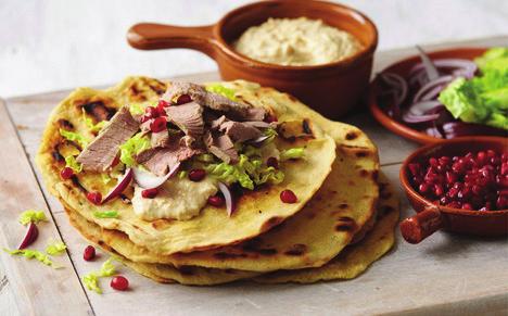 Turkish Lamb Flatbreads Makes: 6 Ready: 40 minutes Prep Time: 20 minutes Cook Time: 20 minutes 260g Leftover Lamb 300g Houmous 1 pack Pomegranate Seeds 1 Red Onion, peeled and thinly sliced 1 Little