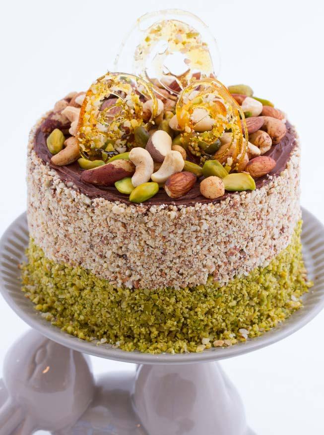 Chai tea cake This dessert cake is filled with tea-infused layers of creamy custard and decorated with spiced nuts. Makes ±8-12 slices Spiced nuts Use purchased spiced nuts or make your own.