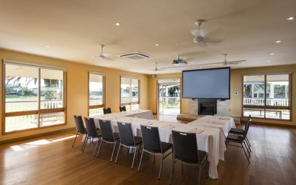 The room boasts a modern internal sound system with roof mounted data projector and screen, ideal for presentations.