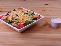 Santa Fe Salad (Small Side Salad) Assorted Greens, Tomatoes, Cucumber, Carrots, Black Olives, Green Pepper,