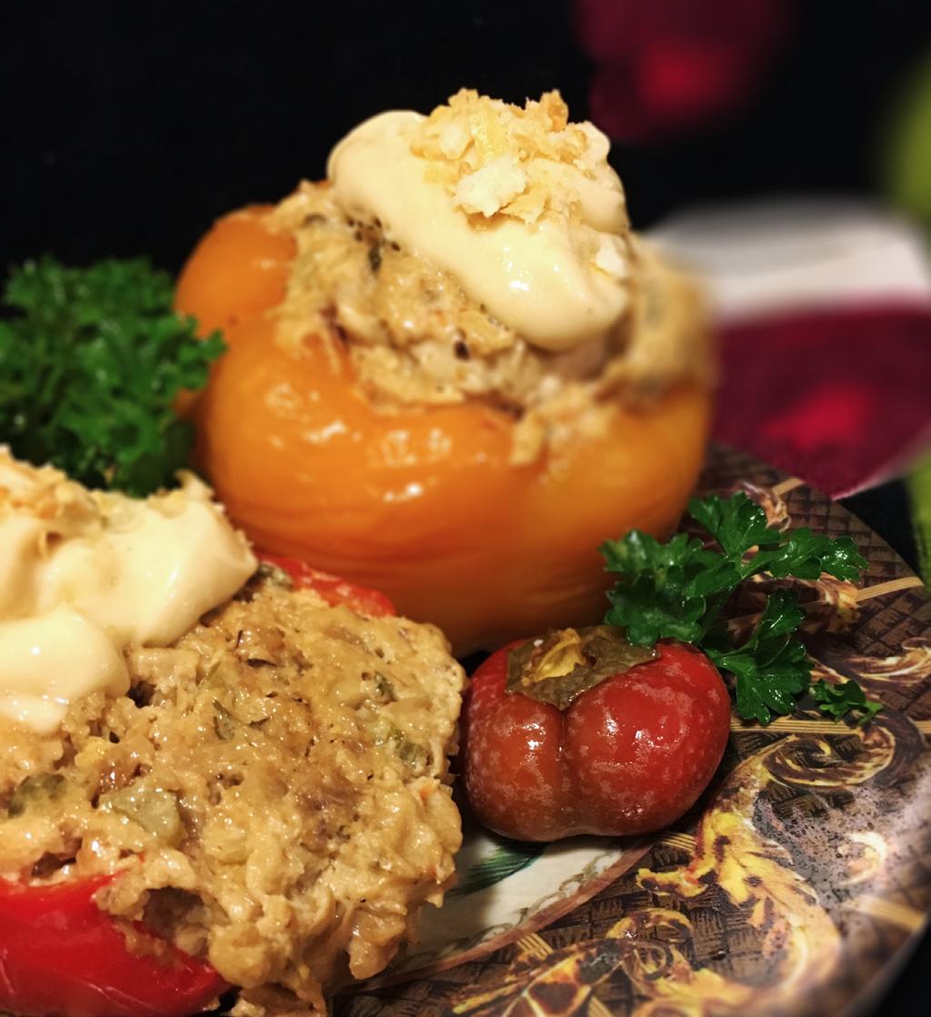 CREAMY CRAB-STUFFED PEPPERS The individual portions and color varieties of stuffed bell peppers make for an elegant presentation at any dinner.