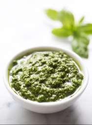 Roasted Garlic and Basil Pesto Spread 5 15 oz. dry roasted garlic cloves ¾ cup lemon juice ~1 cup fresh basil 1 ¼ tsp kosher salt 2 ½ tsp crushed red-pepper flakes 2 ½ tbsp. olive oil 1 ¼ cup water 1.