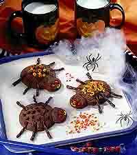Sweet Spider Cookies Serves: 20 1 package (18 ounces) refrigerated sugar cookie dough 1/4 cup unsweetened cocoa powder 3 to 4 tablespoons seedless red raspberry or cherry preserves* Chocolate