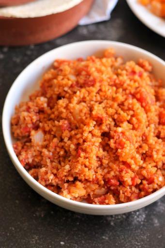 SMALLER FAMILY- SPANISH CAULIFLOWER RICE S I D E D I S H Serves: 3-4 Prep Time: 5 Minutes Cook Time: 15 Minutes 1/4 cup onion, chopped 1/2 Tablespoon olive oil 1/2 (12 ounce) bag frozen riced