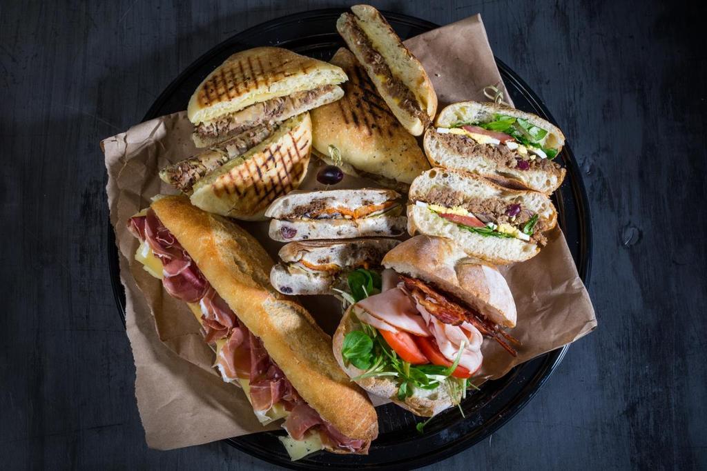 SANDWICH CHOICES Prosciutto & São Jorge cheese baguette Club Ferreira : Smoked turkey, bacon, tomatoes, mayo Cajun, Portuguese bread Smoked salmon bagel Vegetarian sandwich : Grilled vegetables, goat