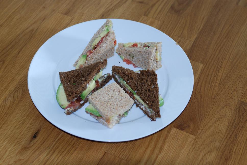 Avocado Sandwiches 1/4 pound of unsalted butter, at room temperature 1 teaspoon of finely chopped cilantro 1 large ripe tomato, peeled, seeded and chopped 6 slices crisp cooked bacon, chopped 2