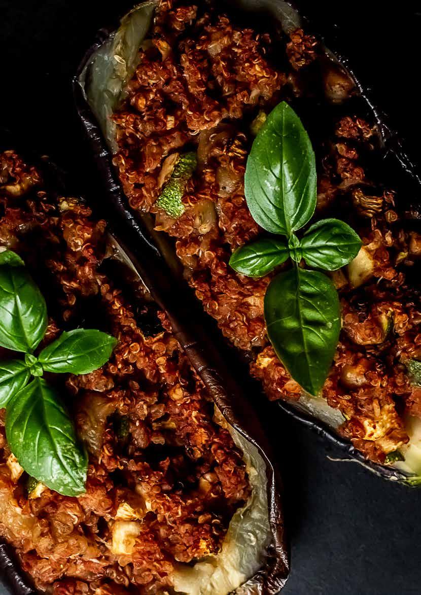 STUFFED AUBERGINE LUNCH 2 aubergines 185g / 1 cup cooked quinoa 4 tbsp tomato paste ½ tsp harissa paste 3 tbsp chopped walnuts ½ courgette / zucchini, finely diced 2 cloves garlic, peeled and minced