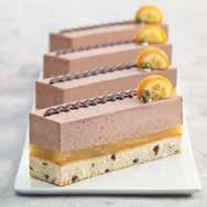 Moist ginger-semolina cake layered with lightly tart lemon creme and attractive decorations featuring chocolate rolls and lemon cream.