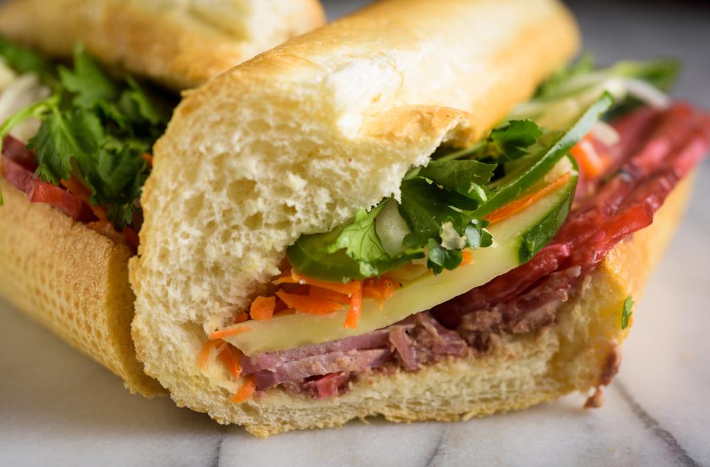 Sandwich Title banh Mi Lee's Combination Sandwiches INCLUDES: House Mayonnaise, House Pickled Carrots & Daikon, Cilantro, Cucumber, Jalapenos, Onions, Salt & Pepper, Soy Sauce Add Ons ($0.50-$3.