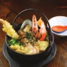 50 Mixed seafood in Japanese u-don soup served in hot (iron)