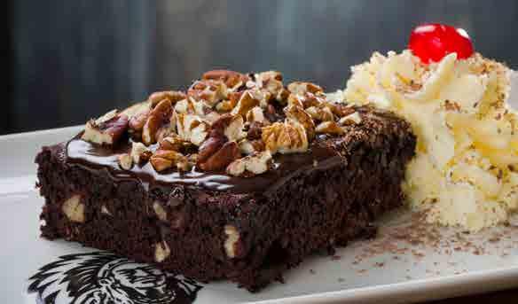 DELICIOUS DESSERTS OUR DESSERTS ARE HOME-MADE DECADENT DELIGHTS CHOCOLATE BROWNIE 500 American-style chocolate fudge brownie smothered in hot chocolate sauce, sprinkled with pecan nuts and served