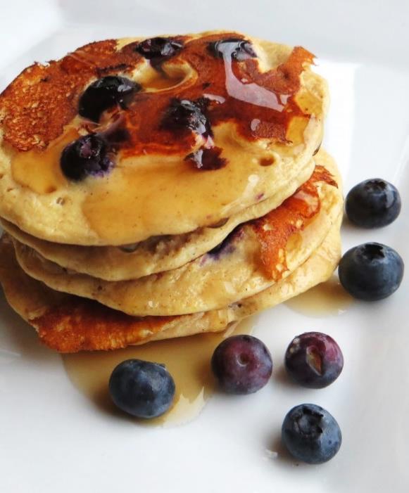 Pour half the mixture into two small pancakes in the pan, then press a few blueberries into each one. 4.