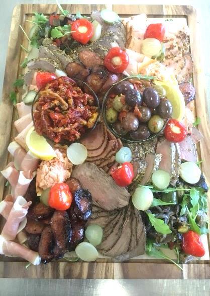 00 serves 15-18 guests Rustic stone Artisan breads, marinated olives, hummus, relishes, char grilled vegetables $70.