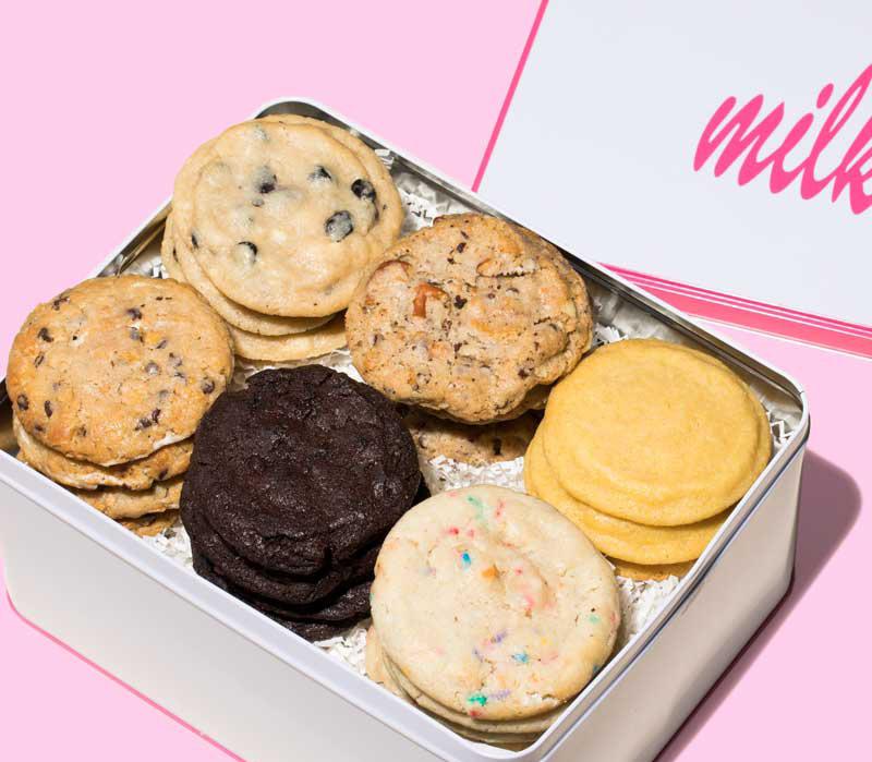 DOZEN ASSORTED $35 COOKIE TIN Two of each cookie flavor, packaged in a windowed Milk Bar tin with opportunity