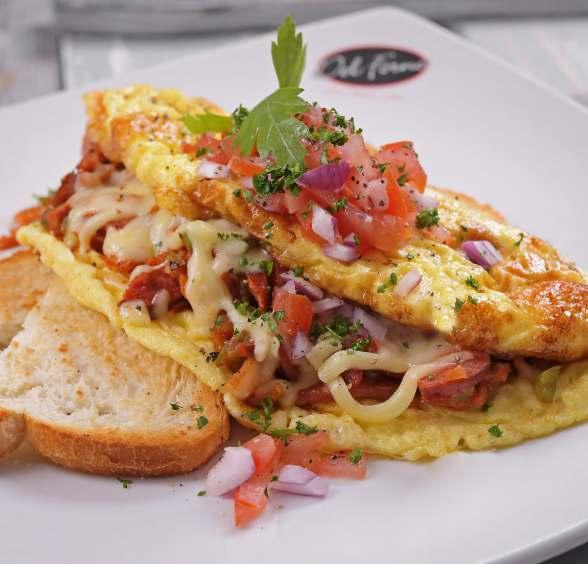 Omelette Three egg omelette served with a slice of toast and mini fries R42 Choose any of these fillings to add to your basic: Tomato or onion or green pepper Cheddar or mozzarella Feta Sautéed