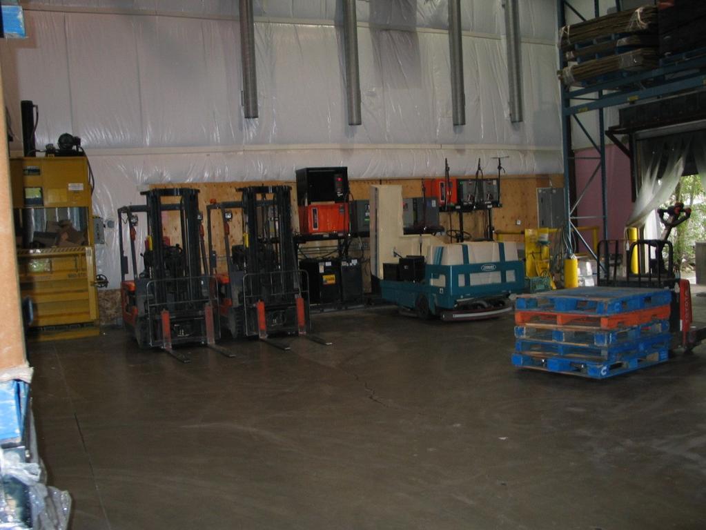The south end of the receiving area, with a cardboard compactor on the far left.