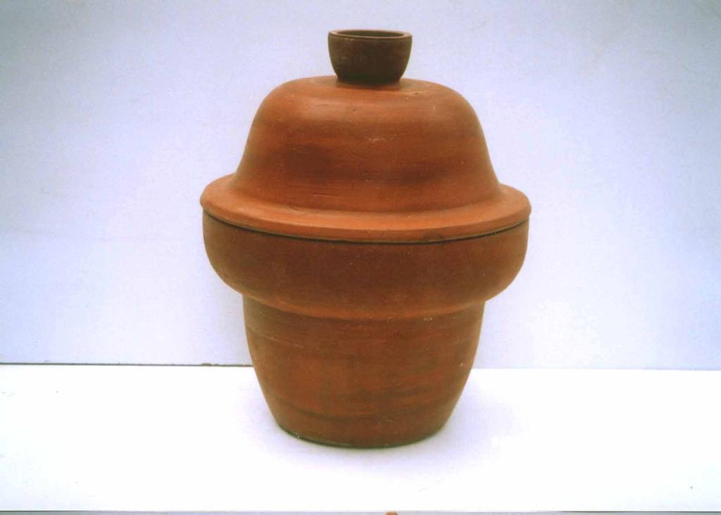 Design No. 3 Content : Terracotta pot of 275mm X 195mm X 39mm Terracotta lid of 395mm X 25mm (Fig. No. 3) Specification : Sheetal Pot has an extra round rim at the top which has to be filled with water.