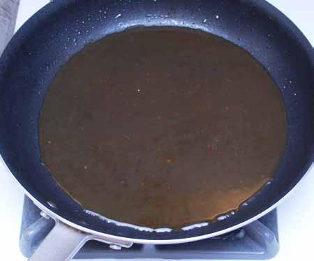 6 Deglaze the pan with a splash of bourbon (2 to 3 tablespoons) and add